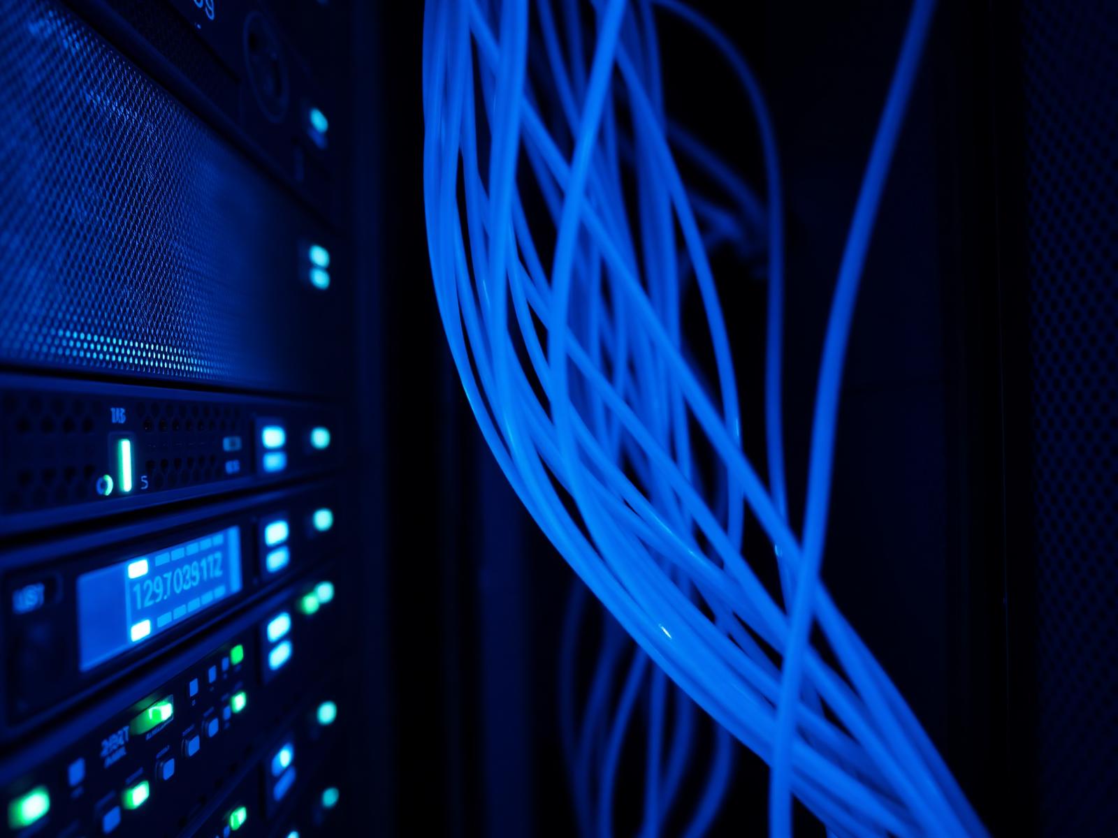 Server rack with fiber optic cables in a modern data center